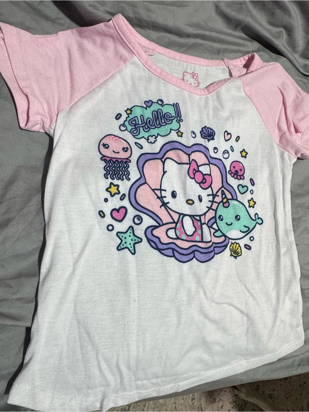 Hello Kitty White Tee with Pink Raglan Sleeves and Colorful Sea Graphic